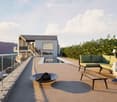 A modern outdoor terrace with a swimming pool, seating area, and scenic mountain view.