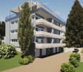 Modern multi-story apartment building with balconies, surrounded by greenery and a paved driveway with a parking spot.