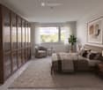 Modern bedroom with a large bed, nightstands, a round chair, a small table, a plant, and a tall wardrobe. The room features large windows with sheer curtains and a neutral color palette.