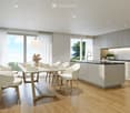 Modern kitchen with white cabinets, wooden floor, dining area with white chairs and table, large windows with curtains, pendant light, and built-in oven.