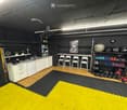 {"type": "Furnished Room", "objects": ["kitchen cabinet", "sink", "faucet", "chair", "ball", "dumbbell", "shelf", "picture frame", "plant", "bottle", "cup", "bottle", "bottle", "bottle", "bottle", "bottle", "bottle", "bottle", "bottle", "bottle", "bottle"