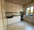 white kitchen with cabinets, sink, dishwasher, oven, granite countertops