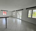 empty room, white walls, white tiles, sliding glass doors, balcony, windows