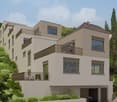 3 story house, beige walls, windows with shutters, balconies on all floors, garage, staircase