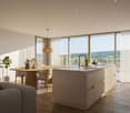 Open concept living area, kitchen, dining area. Wooden floors, large windows, large mirror, wooden table, wooden chairs, couches, large view of the hills, pendant lamp