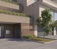 multi-level building, gray garage doors, entrance with glass door and wooden wall, mailbox, tree in front of entrance, modern design