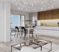 Open layout living room with kitchen and dining area, large windows, high ceiling with chandelier, modern furniture, hardwood floors.