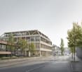 Modern office building with glass facade, multiple floors, rooftop terrace, surrounded by trees and plants, located on a street with pedestrian and bike lanes