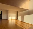 empty room, wooden floor, white walls, wooden ceiling, sunlight