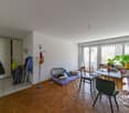 wooden floor, white walls, wardrobe, table, chairs, plants, lamp, open window