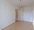 empty room, white walls, wooden floor, open door, light fixture