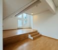 empty room, wooden floor, white walls, window, stairs