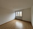 empty room, white walls, wooden floor, white ceiling, window, radiator