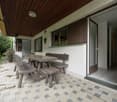 covered patio with ceiling, wooden dining table, 4 chairs, 1 bench, tiled floor