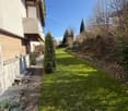 paved pathway, green grass, small garden, plants, trees, balcony, raised ground floor