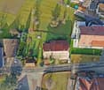 Large farm-like property, two houses, solar panels, green grass, swimming pool, multiple cars parked