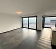 empty room, large windows, balcony, tiled floor, white walls, ceiling light