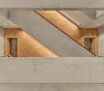 Concrete walls, wooden floor, concrete counter, stairs, golden wall, exit signs