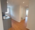 open kitchen, white walls, wooden floors, kitchen sink, dishwasher, window, walk-in door