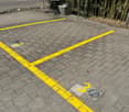 Brick-paved parking lot with clearly marked parking spaces
