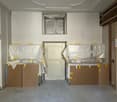 empty room, white walls, ceiling with moldings, two doors, two covered objects, floor covered with plastic