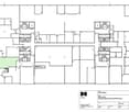 Multi-purpose space on the ground floor, several office rooms on the first floor, storage areas, meeting rooms, and staircases connecting the floors.