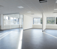 Spacious room, large glass windows, grey tiles, white walls, ceiling panels