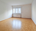 empty room, white walls, window, radiator, parquet floor