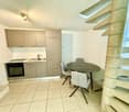 small kitchen, modern design, integrated oven, double sink, round table with chairs, tiled floor