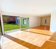 empty room, wooden floor, sliding glass doors, balcony, view of the garden