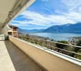 tiled floor, metal railing, lake view, mountain view