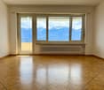 empty room, wooden floor, large windows, balcony, white walls, white radiator
