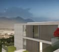 Modern concrete and glass building with balconies, surrounded by lush greenery and with a scenic mountain view in the background