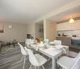 Modern kitchen with modern appliances and a dining area.