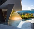 Modern house with geometric design, swimming pool, mountain view