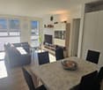 balcony, TV, dining table, sofa, coffee table, floor lamp
