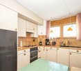 modern kitchen, granite countertops, tile backsplash, stainless steel appliances, dishwasher, double oven