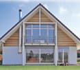 Detached house, sloping roof, modern style, wooden siding, large windows, balcony with railing, white walls