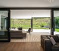 wood floor, leather sofa, wooden balcony, green landscape