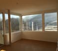 large windows, wooden floor, balcony, scenic view