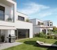 Modern two-story house with white exterior, large windows, balconies, and a patio area with a barbecue grill and outdoor seating. The house is surrounded by a well-manicured lawn and landscaping.