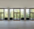 large windows, balcony, hardwood floor, radiators, railings