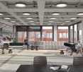 Large open space, modern decor, seating area with couches and chairs, tables, carpeted floor, multiple large windows, high ceiling with ceiling lights.