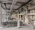 Large industrial facility with multiple floors, numerous machines, large glass windows, metal staircases, office areas