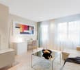 modern design, large windows, modern furniture, light walls, hardwood floor