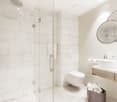 white tiles, modern design, glass shower enclosure, white porcelain sink, white toilet, modern faucets, mirrors, toilet paper holder, toiletries