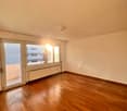 empty room, wooden floor, white walls, large windows, balcony, sunlight