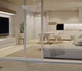 Open plan living room and kitchen, large windows, modern furniture, flat screen TV, dining table, couch, rug, potted plant