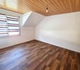 empty room, wooden floor, white walls, wooden ceiling, window with blinds