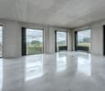 large windows, concrete walls, tiled floor, modern design